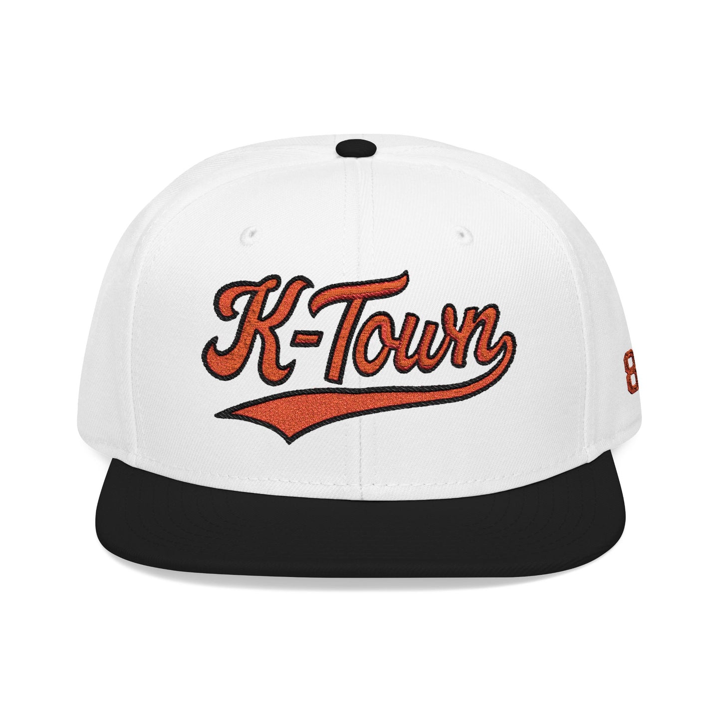 White and black cap with 'K-Town' text on a white background