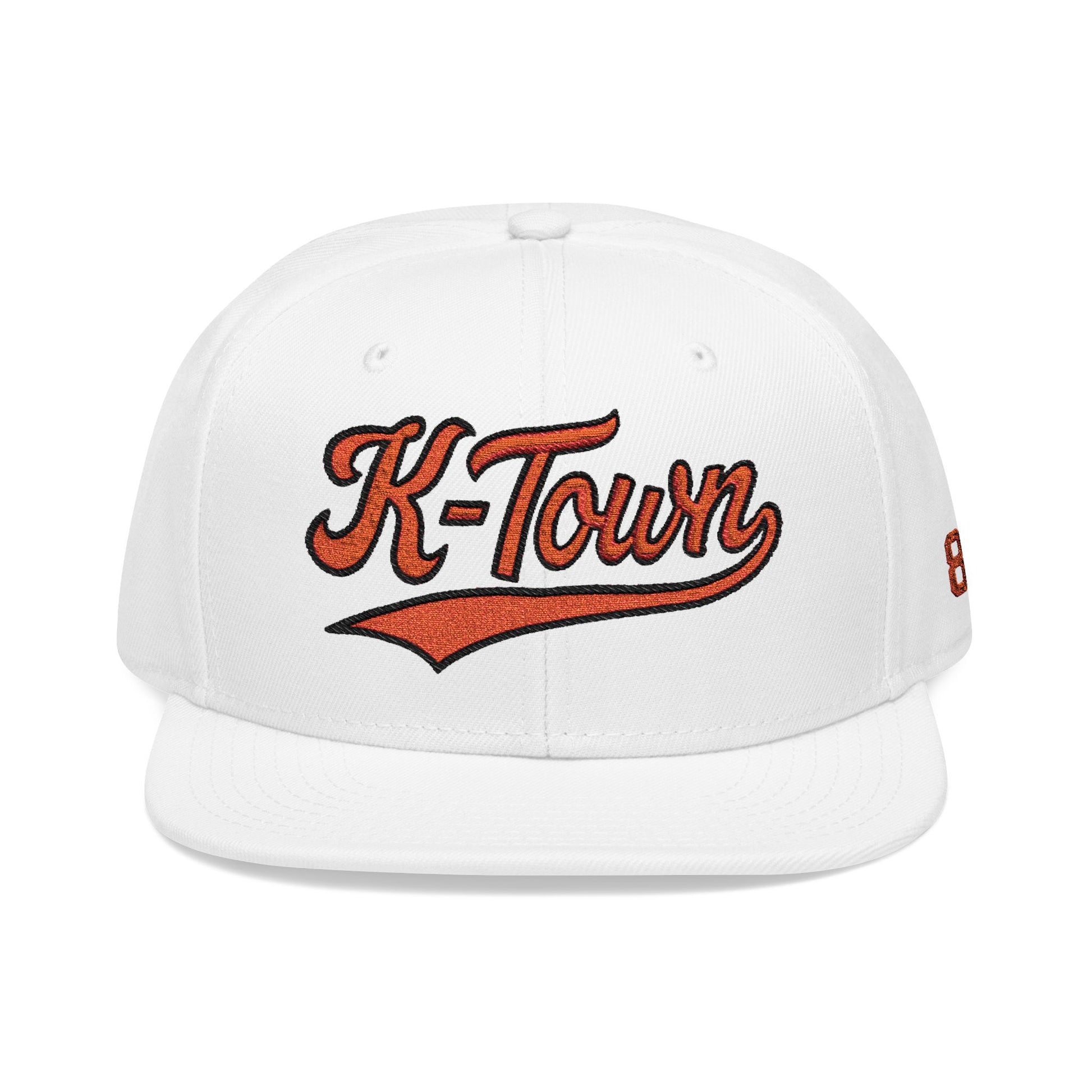 White cap with 'K-Town' text in Orange on a white background